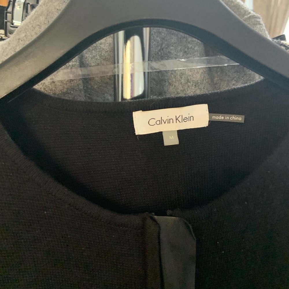 Sweater with leather pockets